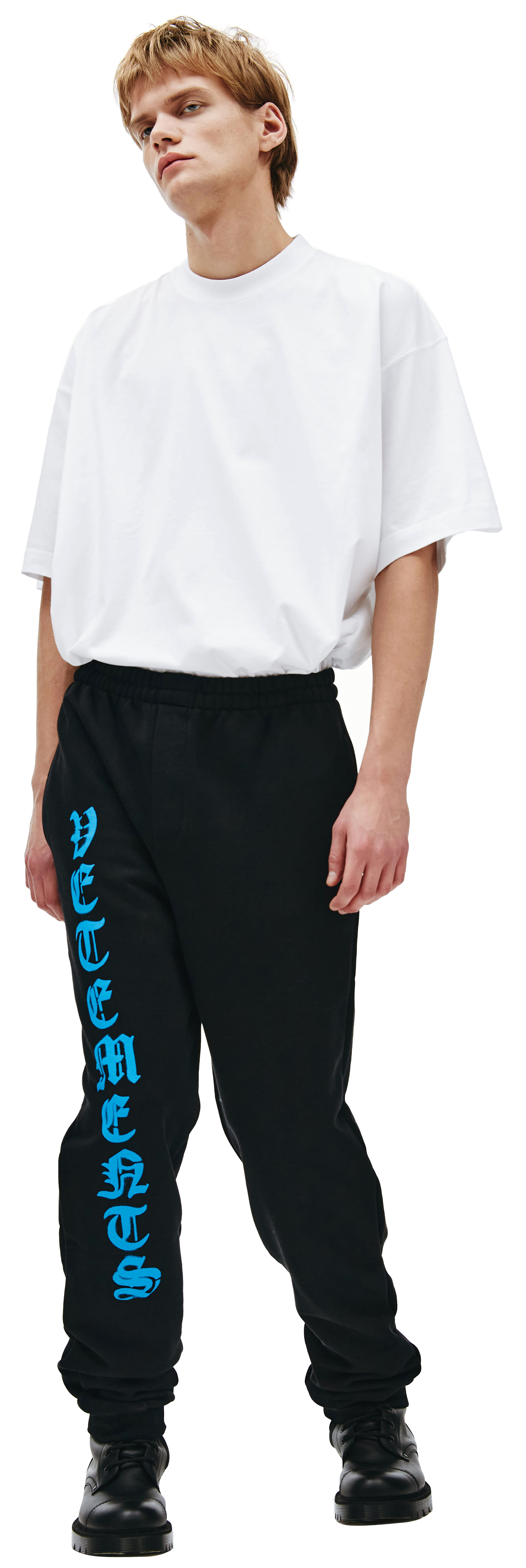 Buy VETEMENTS men anarchy logo pants in black for $437 online on