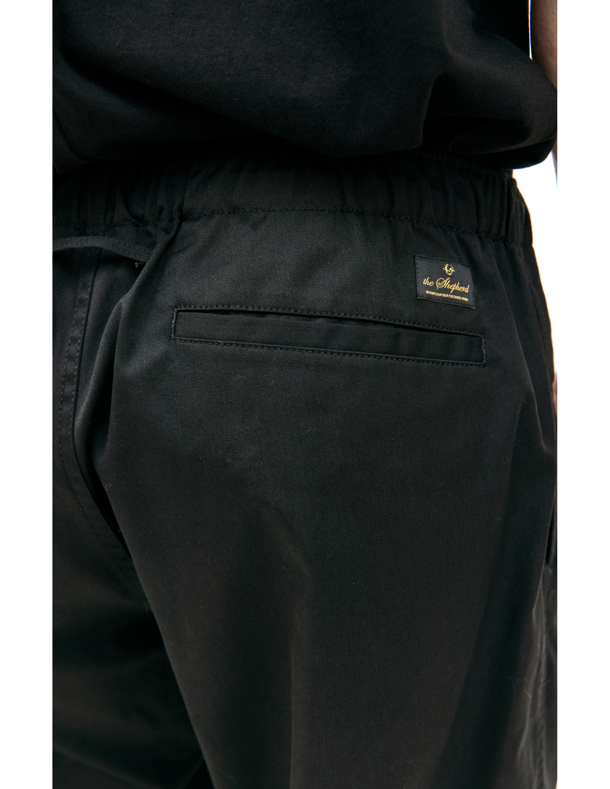 Shop Undercover Embroidered Logo Trousers In Black