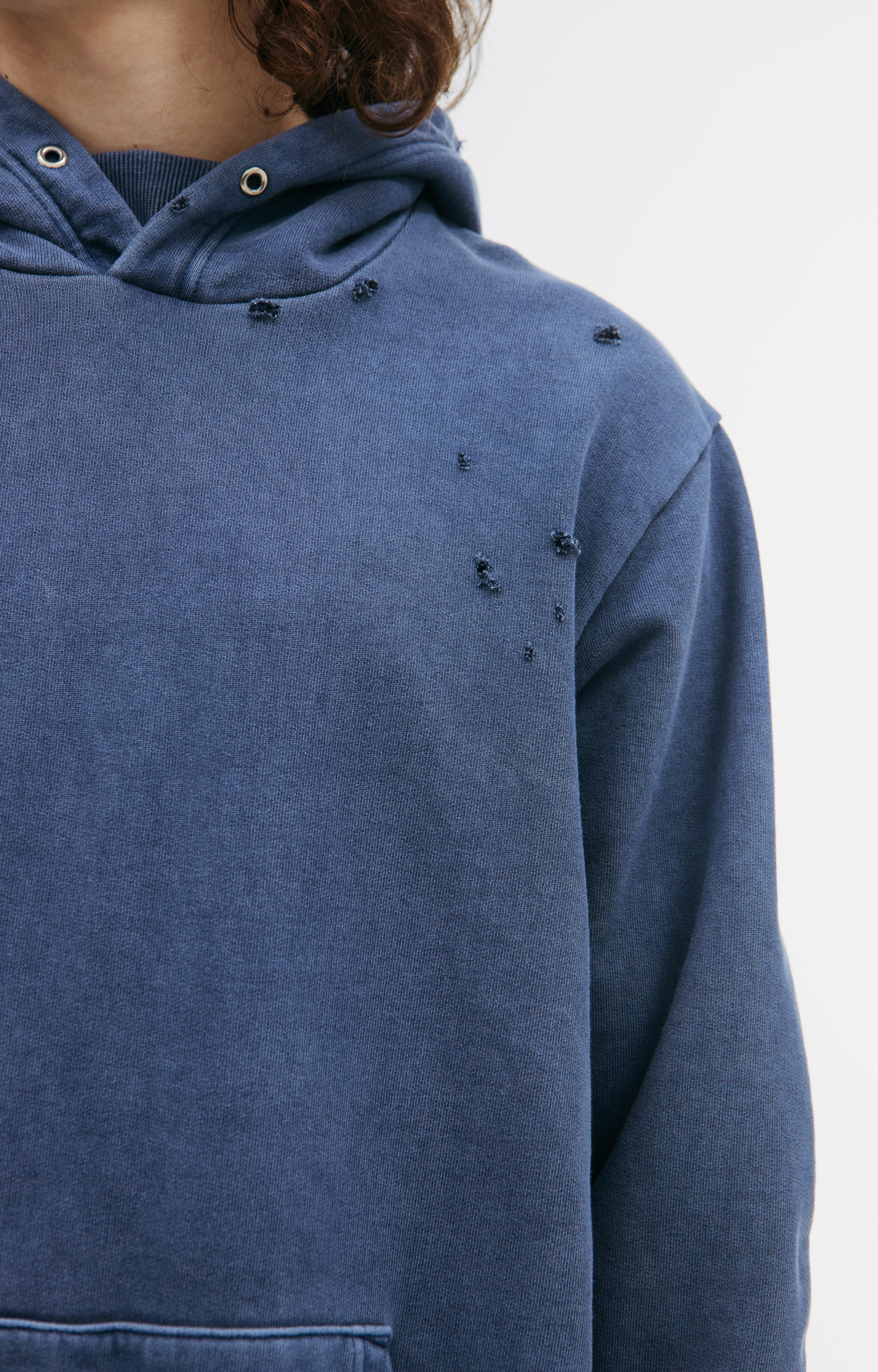 Buy Undercover men blue hoodie with scuffed effect for $411