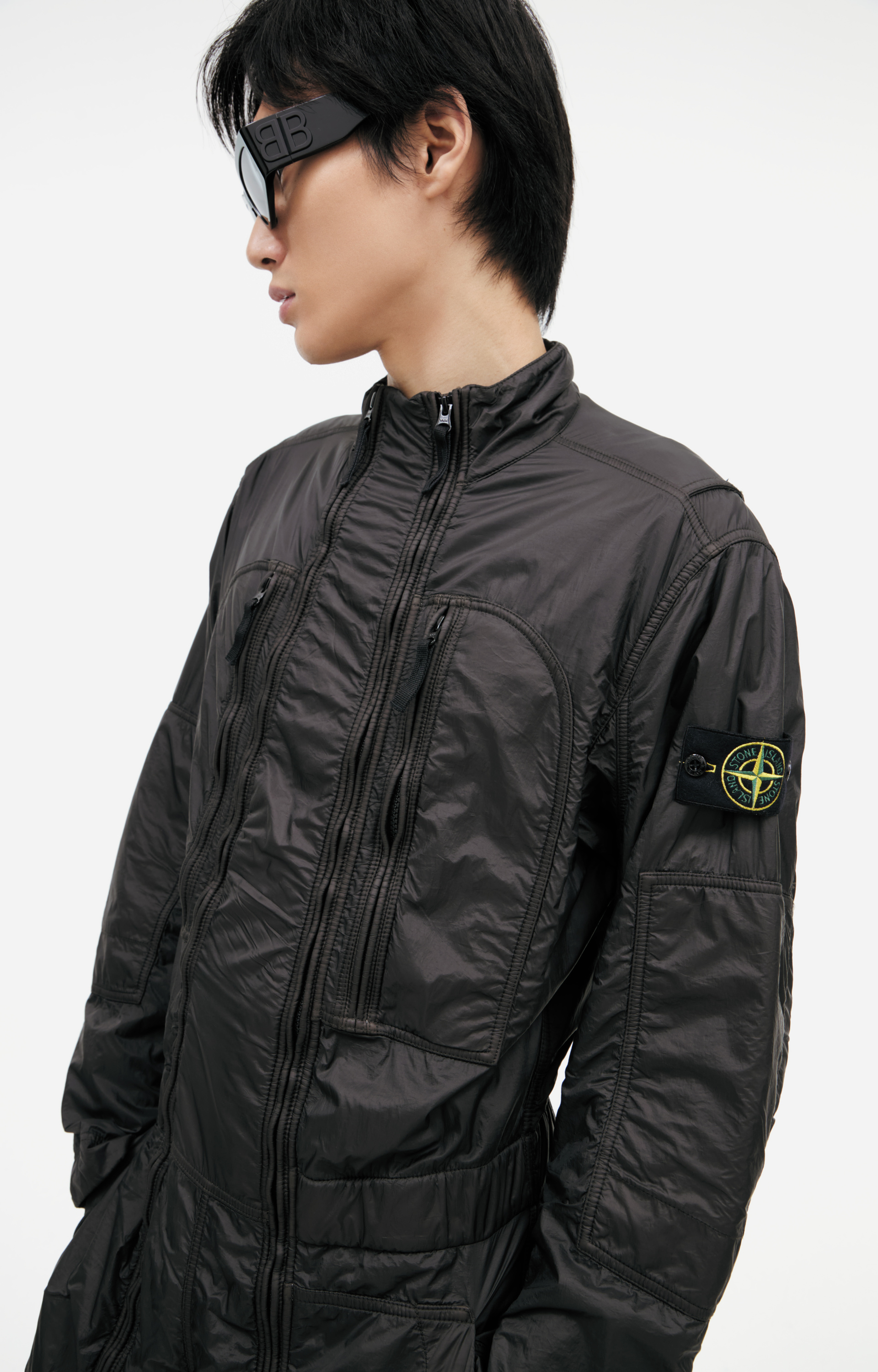 Stone Island Jumpsuit with a patch on the sleeve