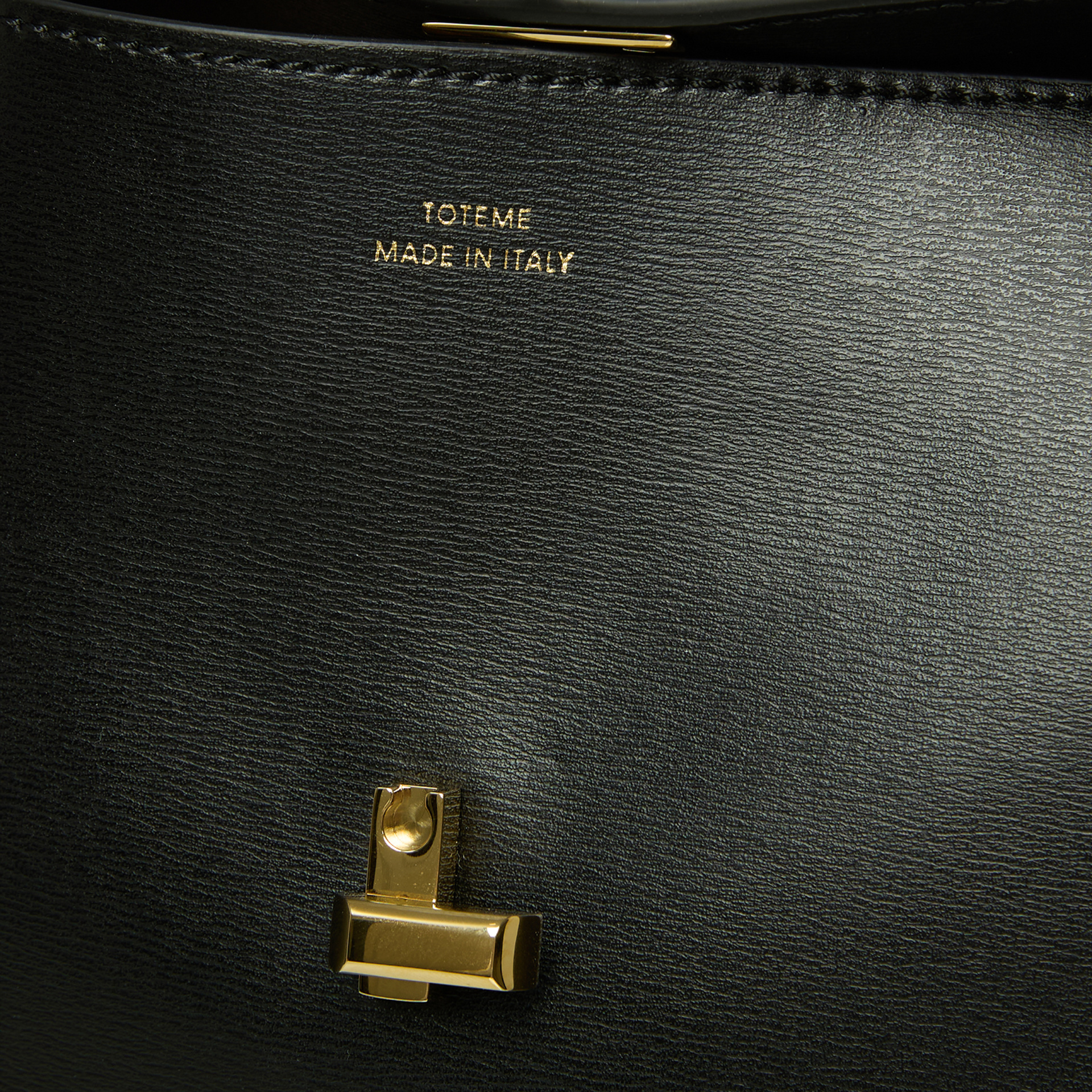 TOTEME Black TOTEME clutch with a gold-tone clasp