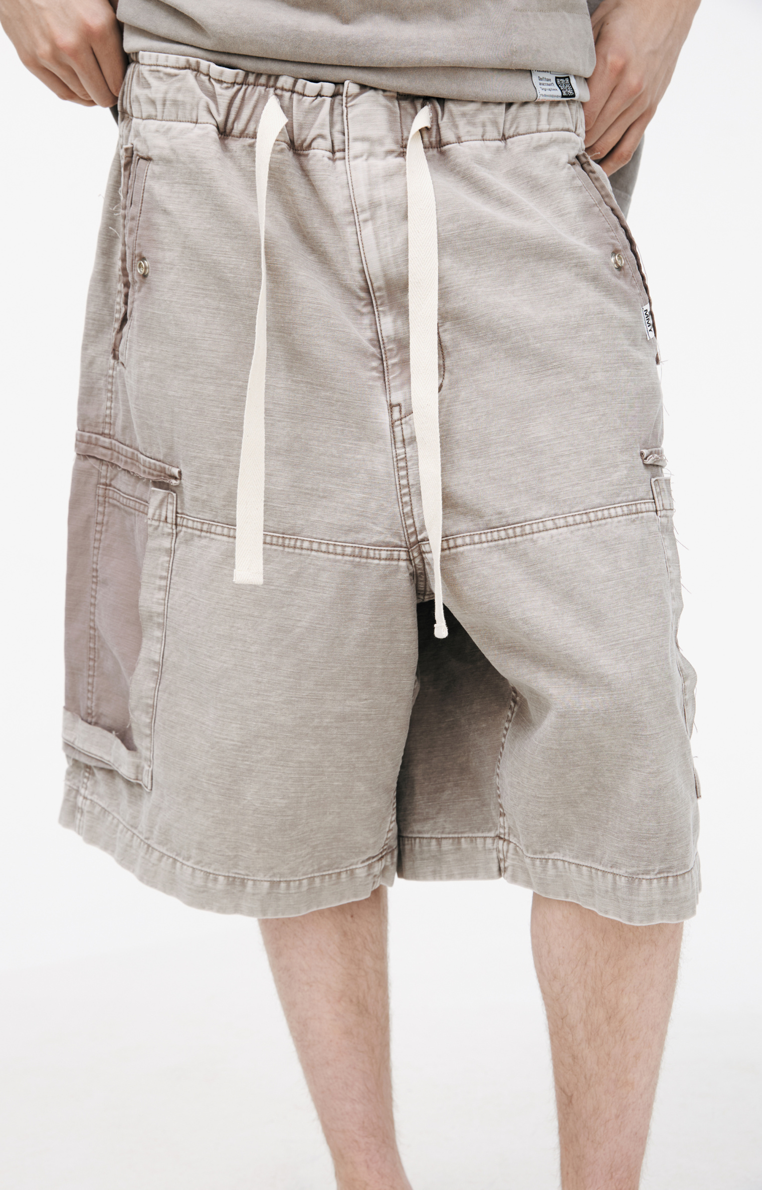 Buy Maison Mihara Yasuhiro men beige shorts with a torn-off pocket