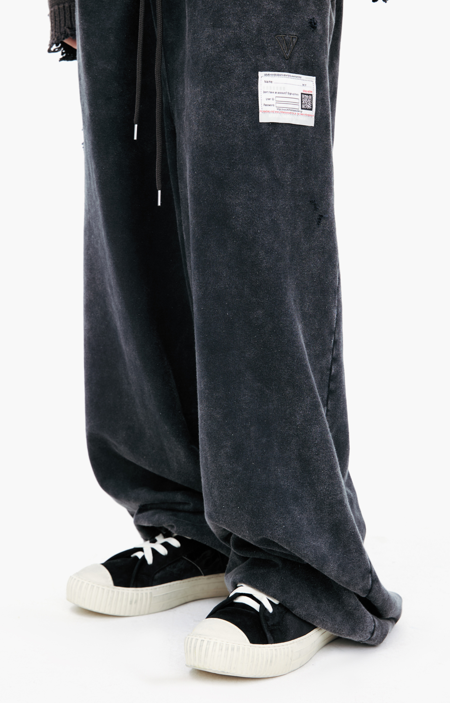 Buy Maison Mihara Yasuhiro men black logo wide sweatpants for $585
