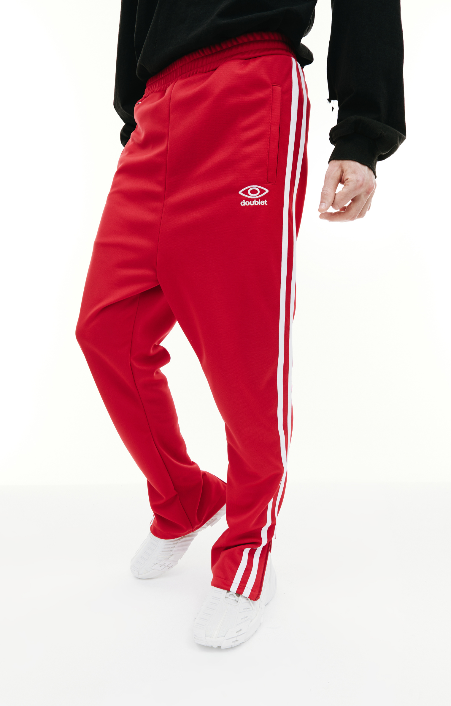 Buy Doublet men red invisible track pants for $246 online on SV77 