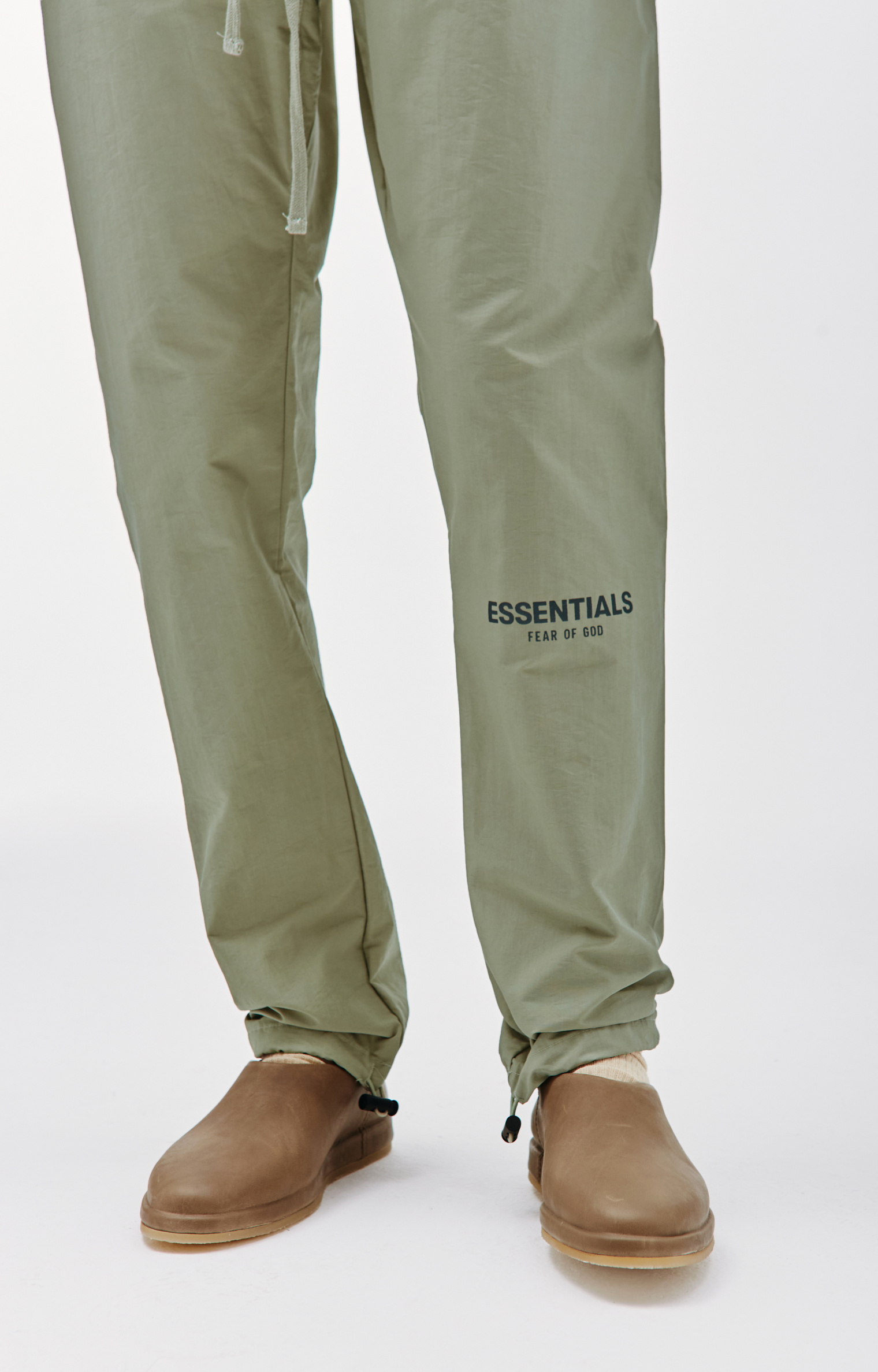 Buy Fear of God Essentials men green track pant with logo for $195