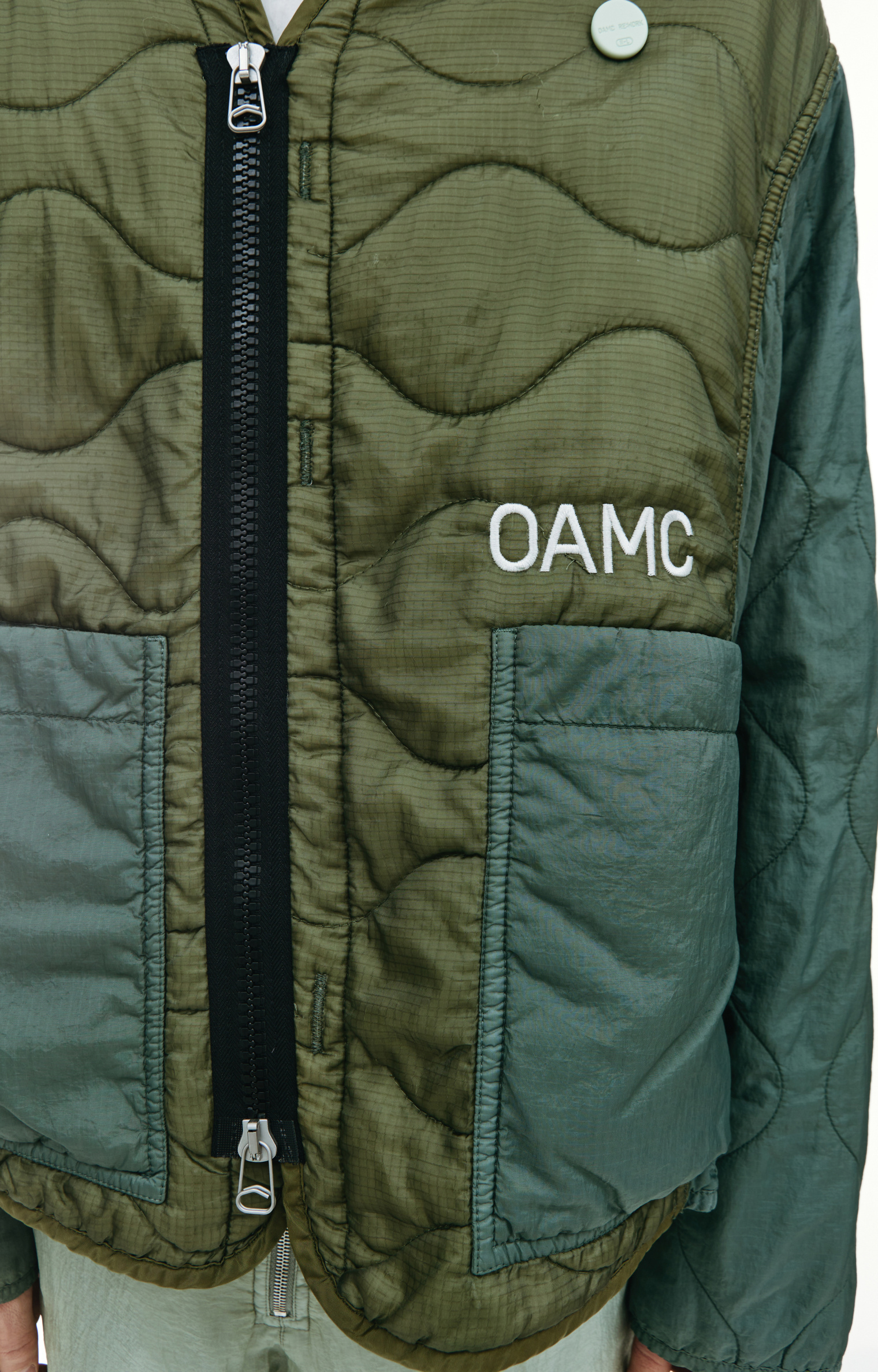 Buy OAMC men green re:work peacemaker quilted jacket for $933 