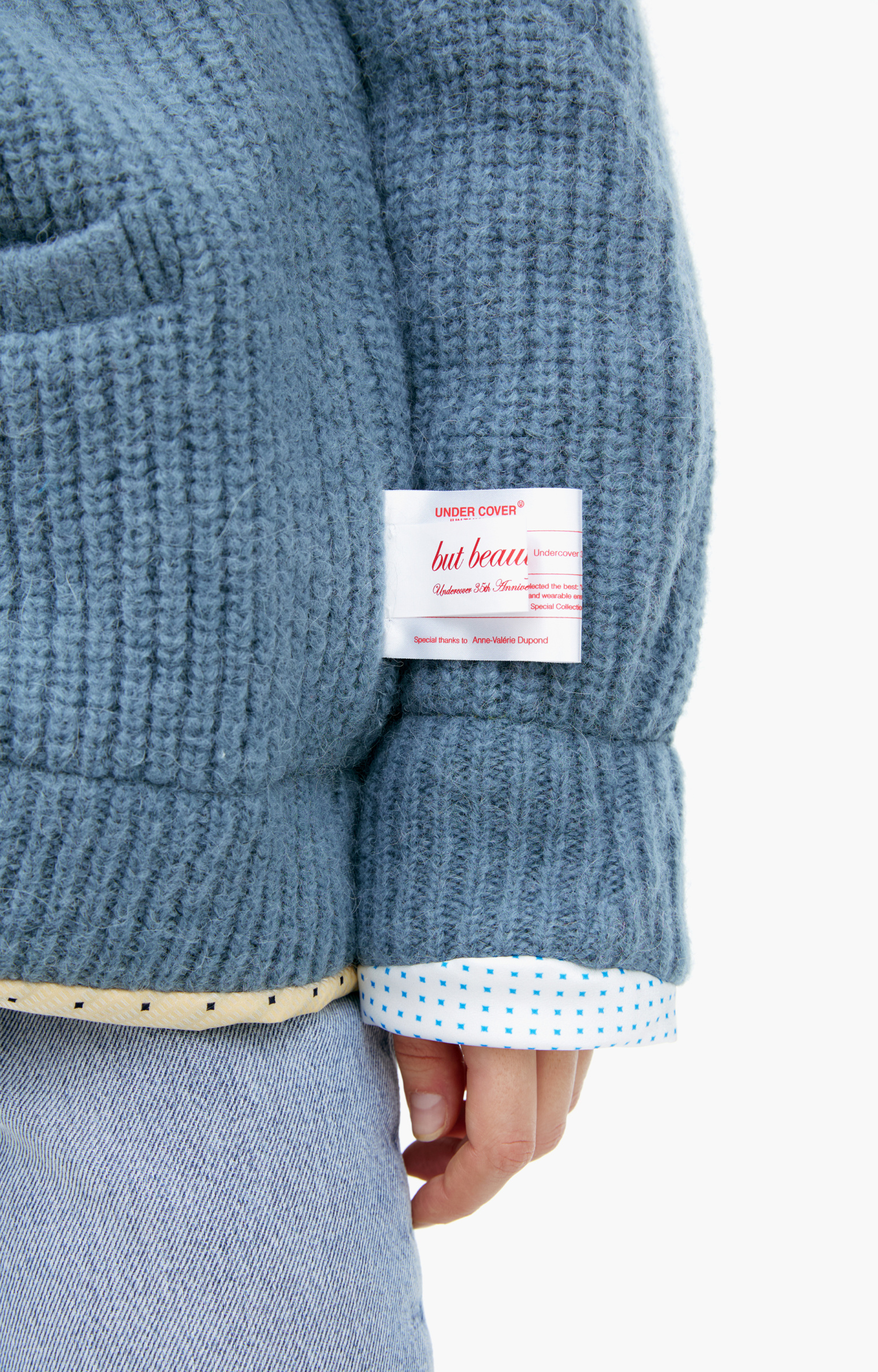 Buy Undercover women blue cardigan with slanted seams for $943