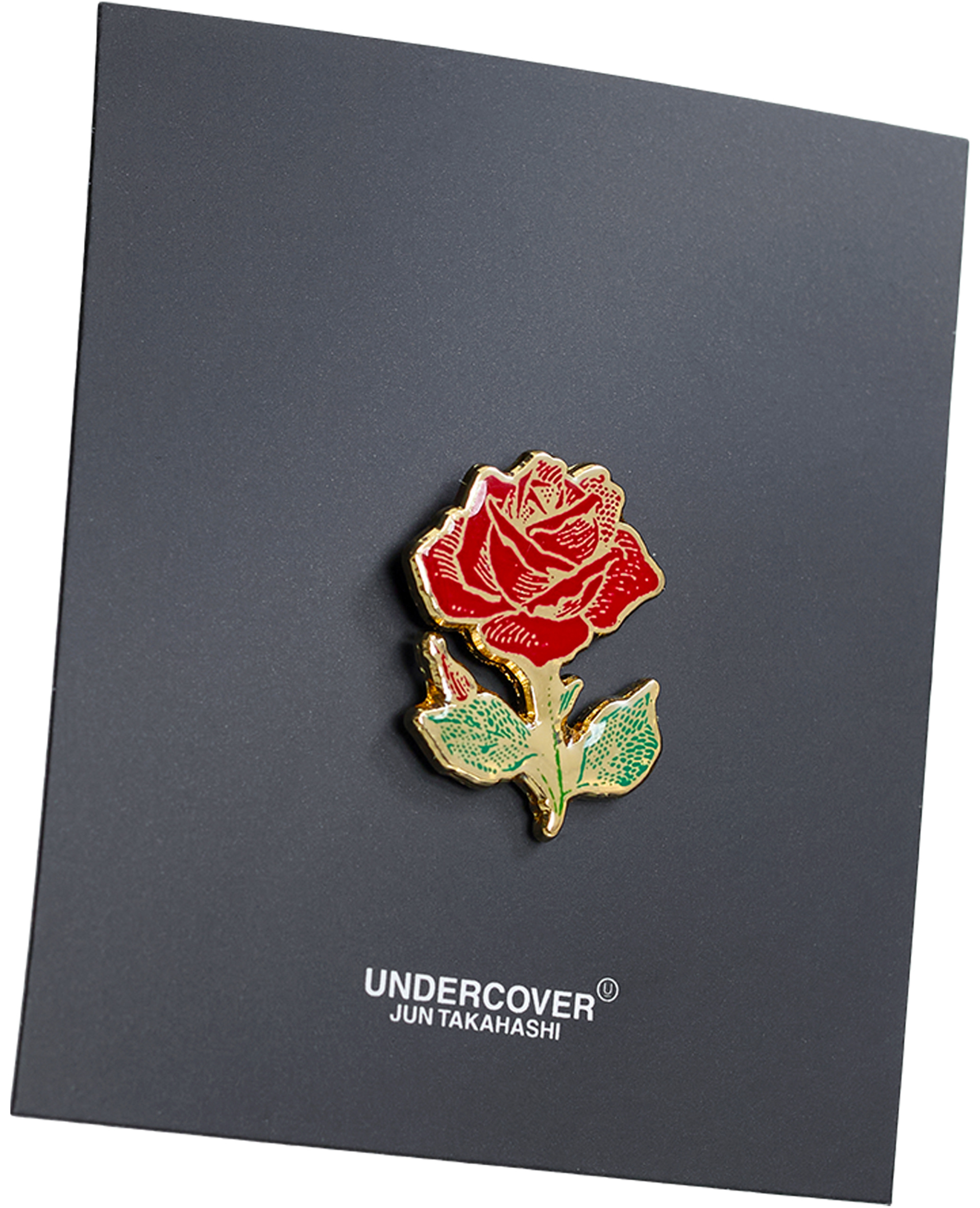 Undercover A rose-shaped badge