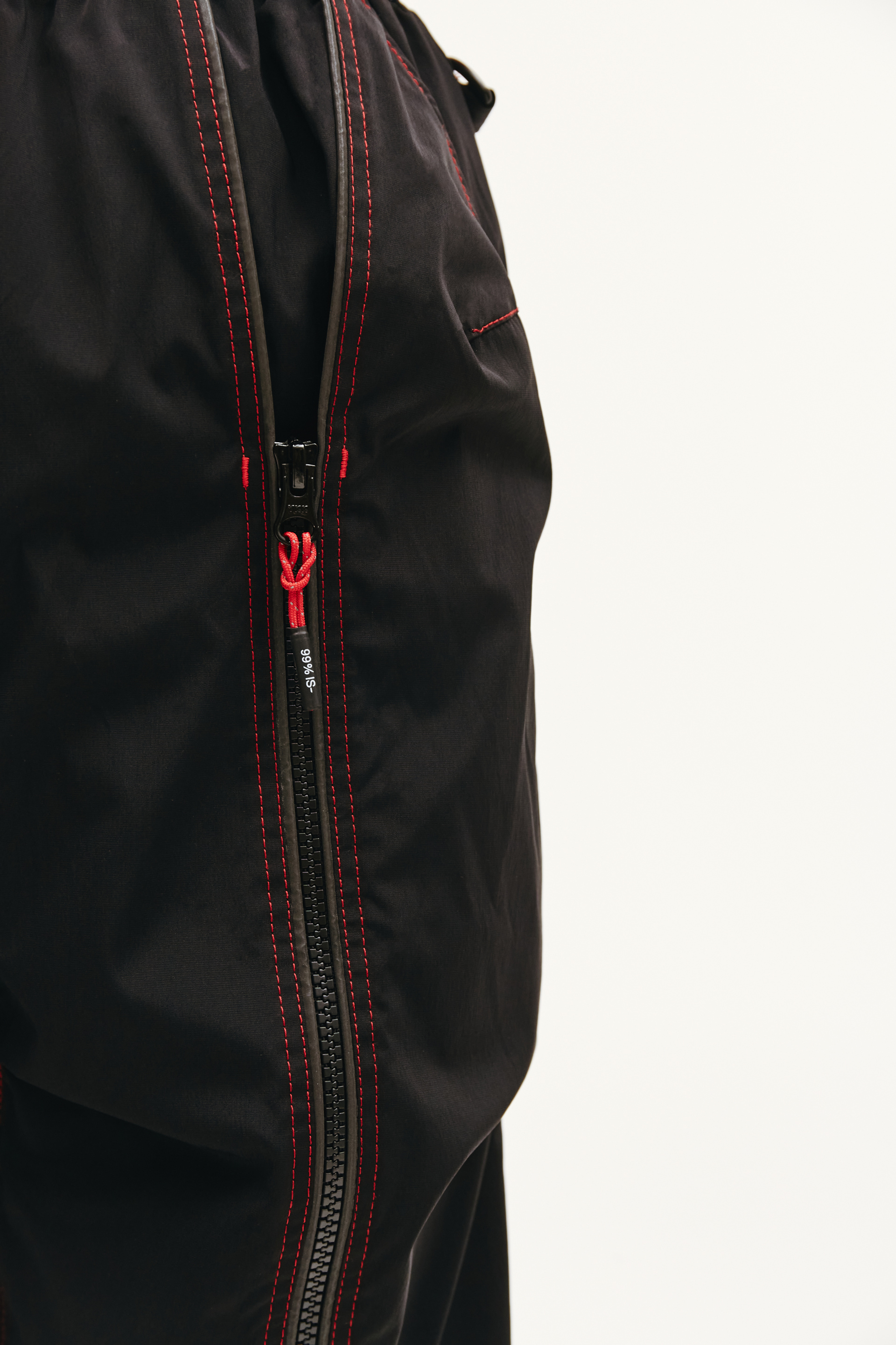 99% IS Black Trousers With Red Seams
