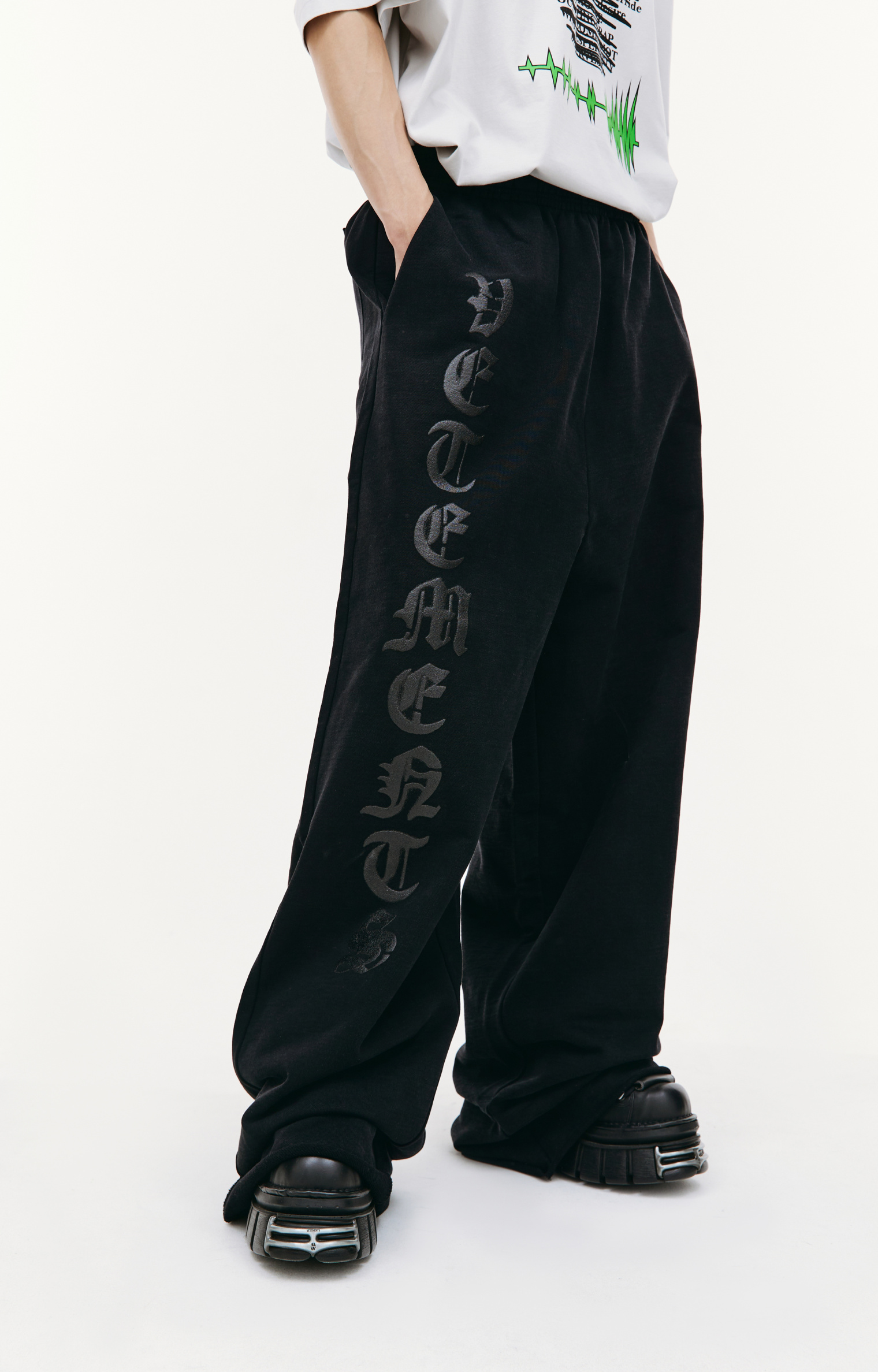 Buy VETEMENTS men black anarchy printed sweatpants for $1,320